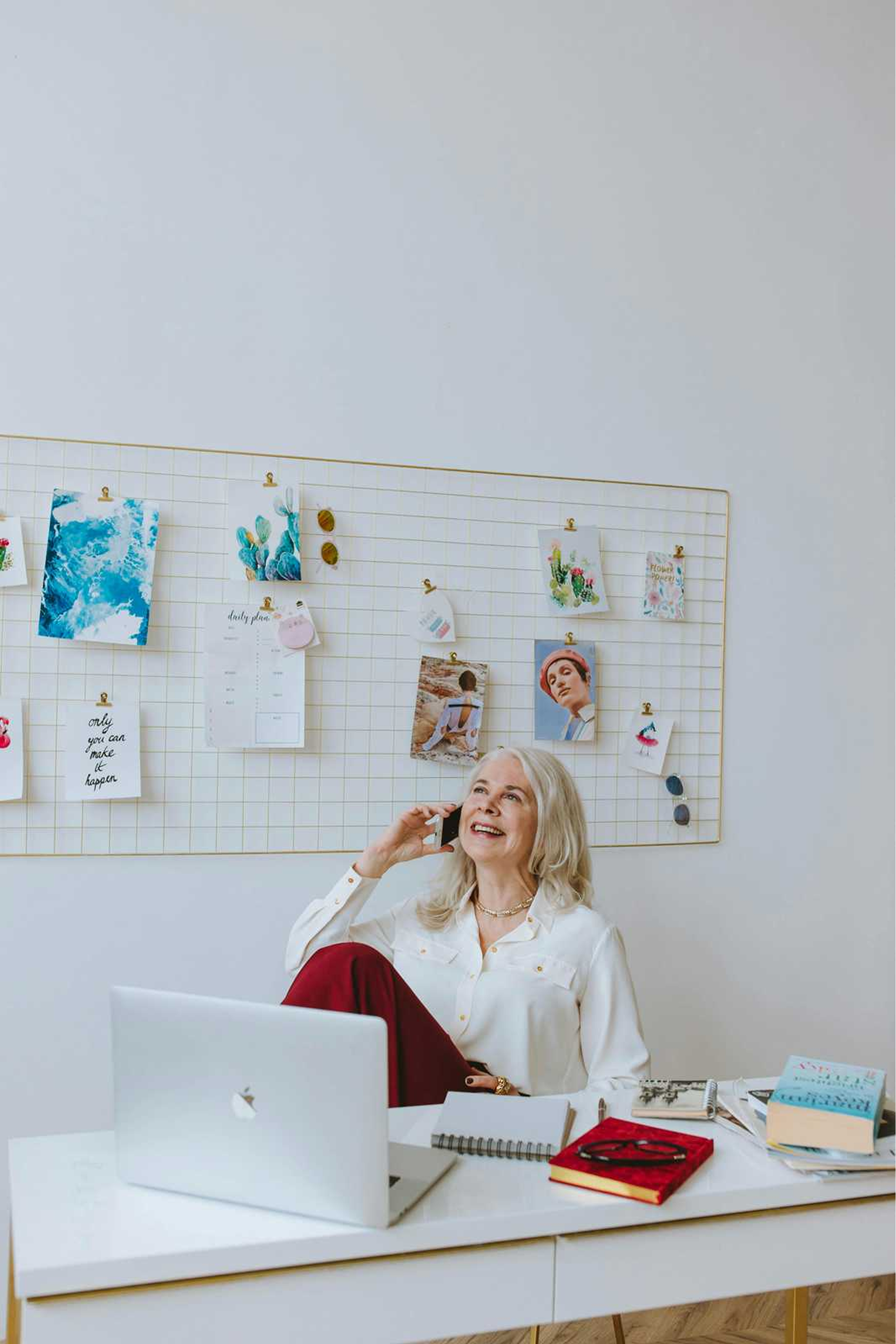 Professional woman on phone call in creative workspace